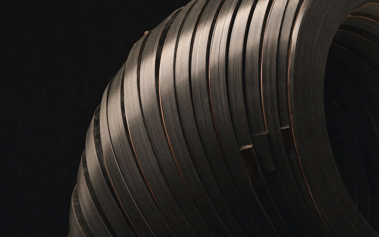 A pulsed-field coil assembly receding into a dark studio
